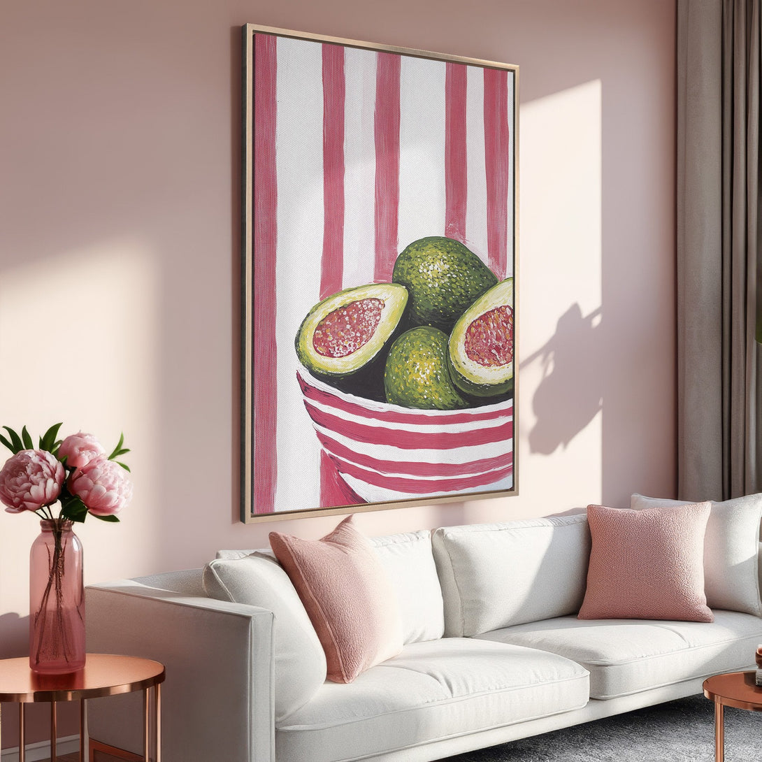 Framed Wall Art featuring a vibrant avocado painting in a modern style. Soft pink and green color palette adds a touch of freshness to any room. Shop now!