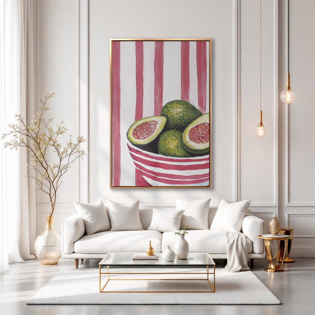 Framed Wall Art: Modern painting of avocados in a bowl with red stripes, displayed in a bright, stylish interior. Green, red, and white color palette.