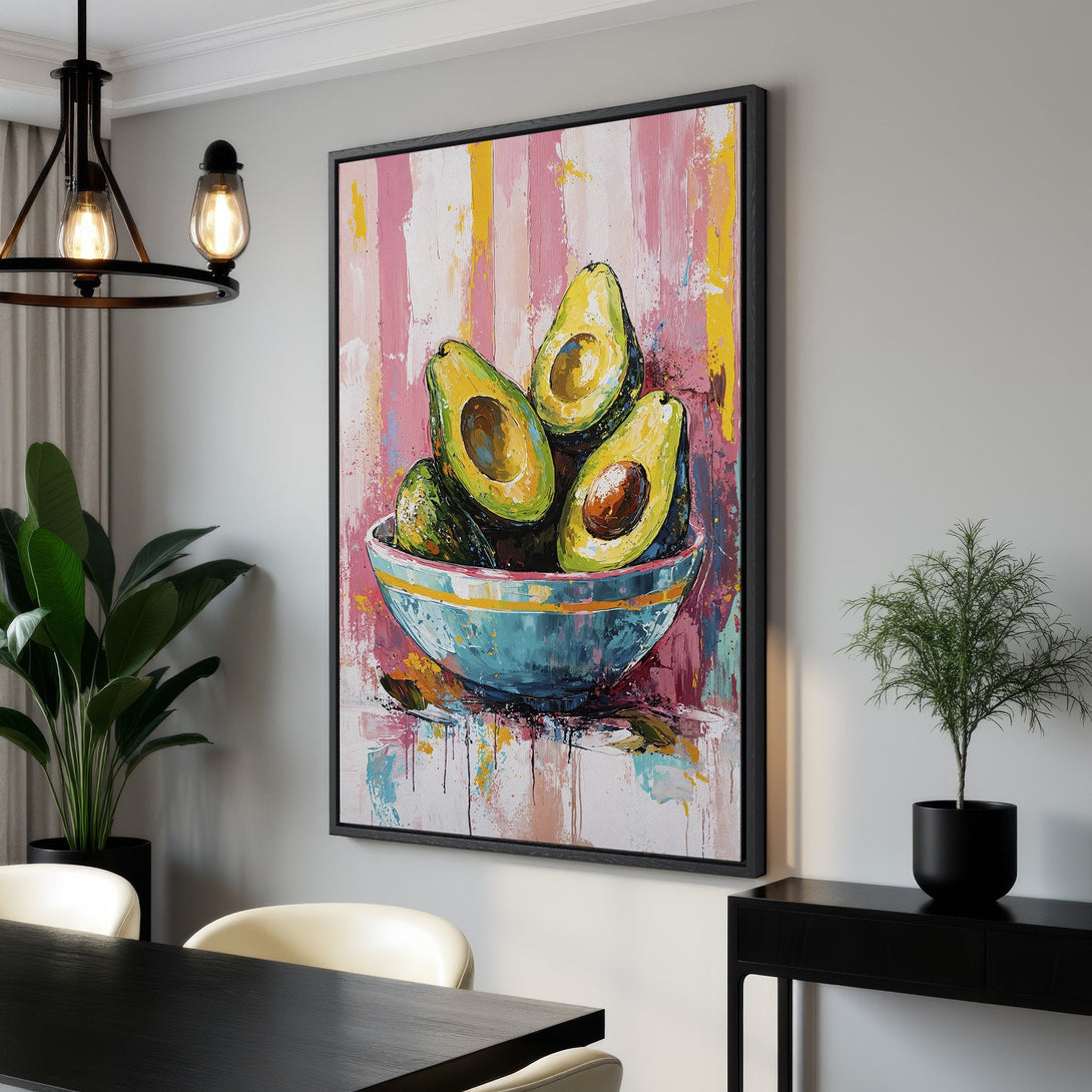 Framed Wall Art: Vibrant avocado painting with a colorful abstract background. Modern art with pink, yellow, and green hues perfect for kitchen decor.