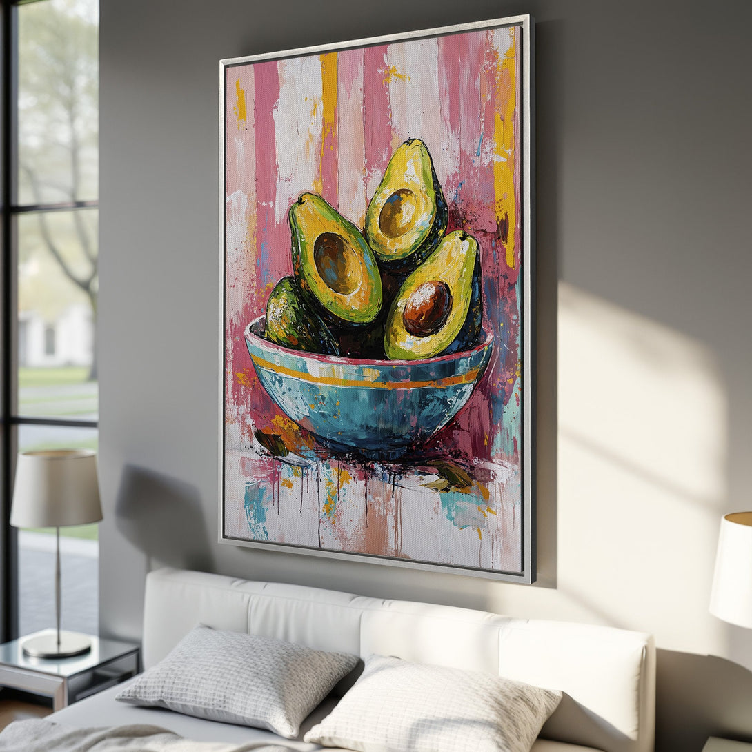 Framed Wall Art featuring a vibrant avocado still life painting in an abstract style. Colorful pink, yellow, and teal palette. Perfect for kitchen or dining room decor.