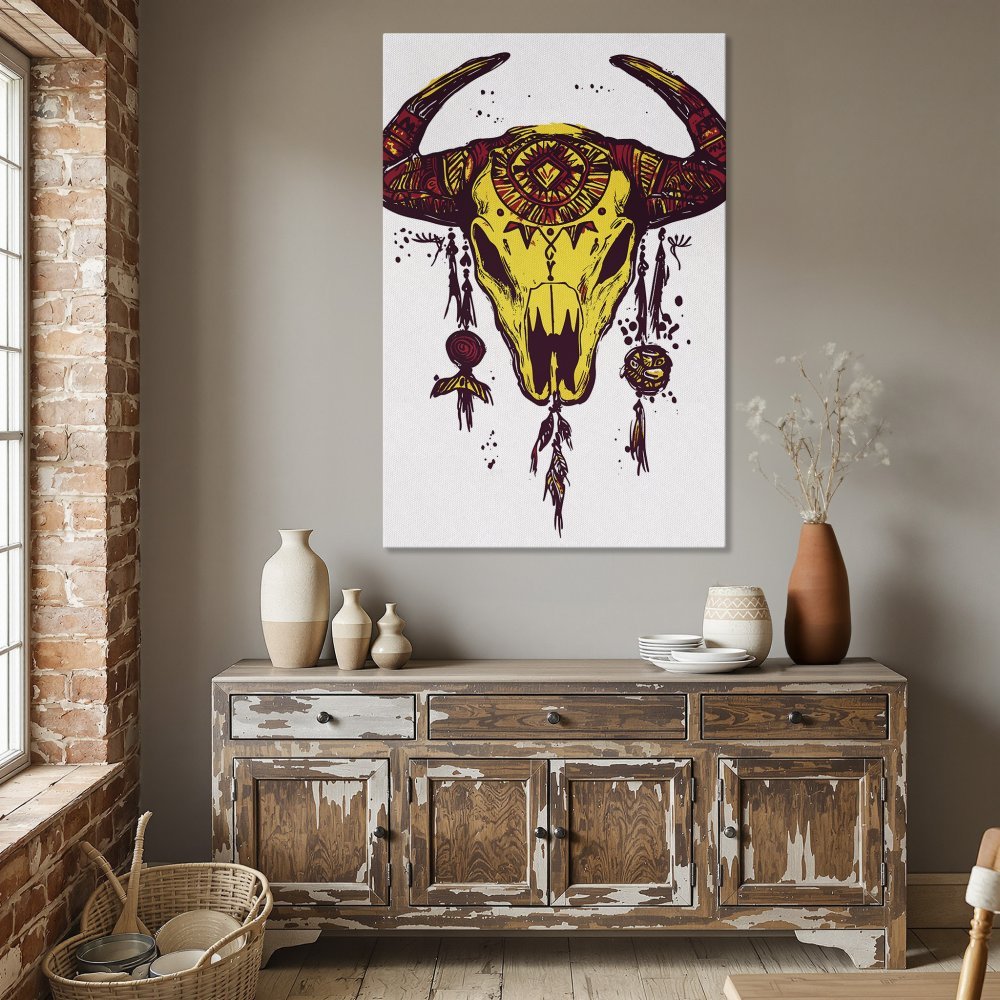 Framed Wall Art: Boho bull skull canvas print in yellow and burgundy, perfect for dining room decor. Add a touch of tribal style!