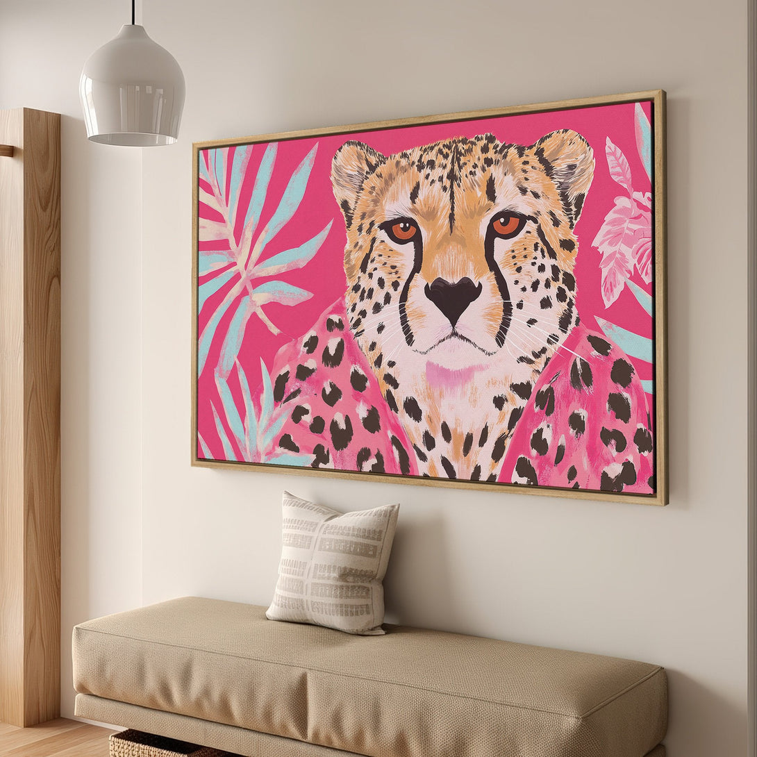 Framed Wall Art featuring a stylish cheetah portrait in a vibrant pink, teal, and tan color palette. Perfect for adding a pop of color to your home!