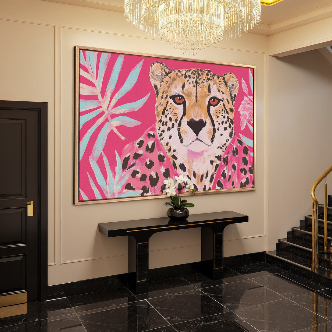 Framed Wall Art: Vibrant cheetah portrait on pink background. Modern style with tropical accents. Adds a pop of color to any space.