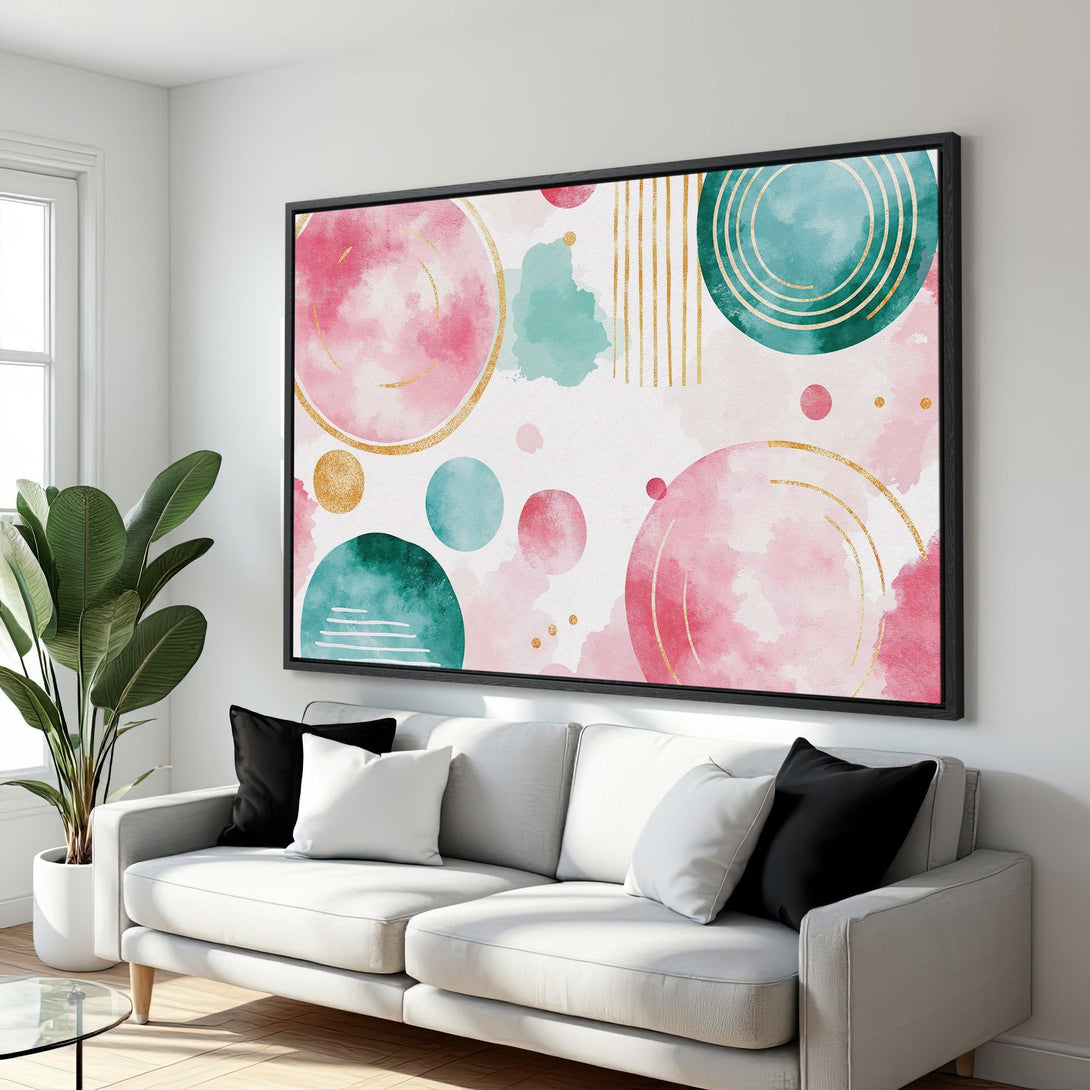 Framed Wall Art featuring an abstract watercolor design with pink, teal, and gold accents. Modern art perfect for living room decor.