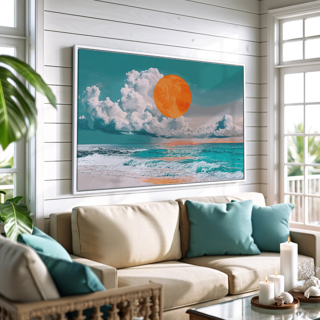 Framed Wall Art featuring a vibrant ocean sunset with a teal and orange color palette, adding coastal charm to a living room.