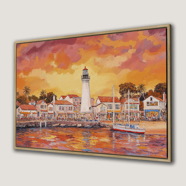 Framed Wall Art: Coastal sunset scene with lighthouse, boats, and buildings. Warm orange and red color palette. Perfect for adding a touch of art to your home.