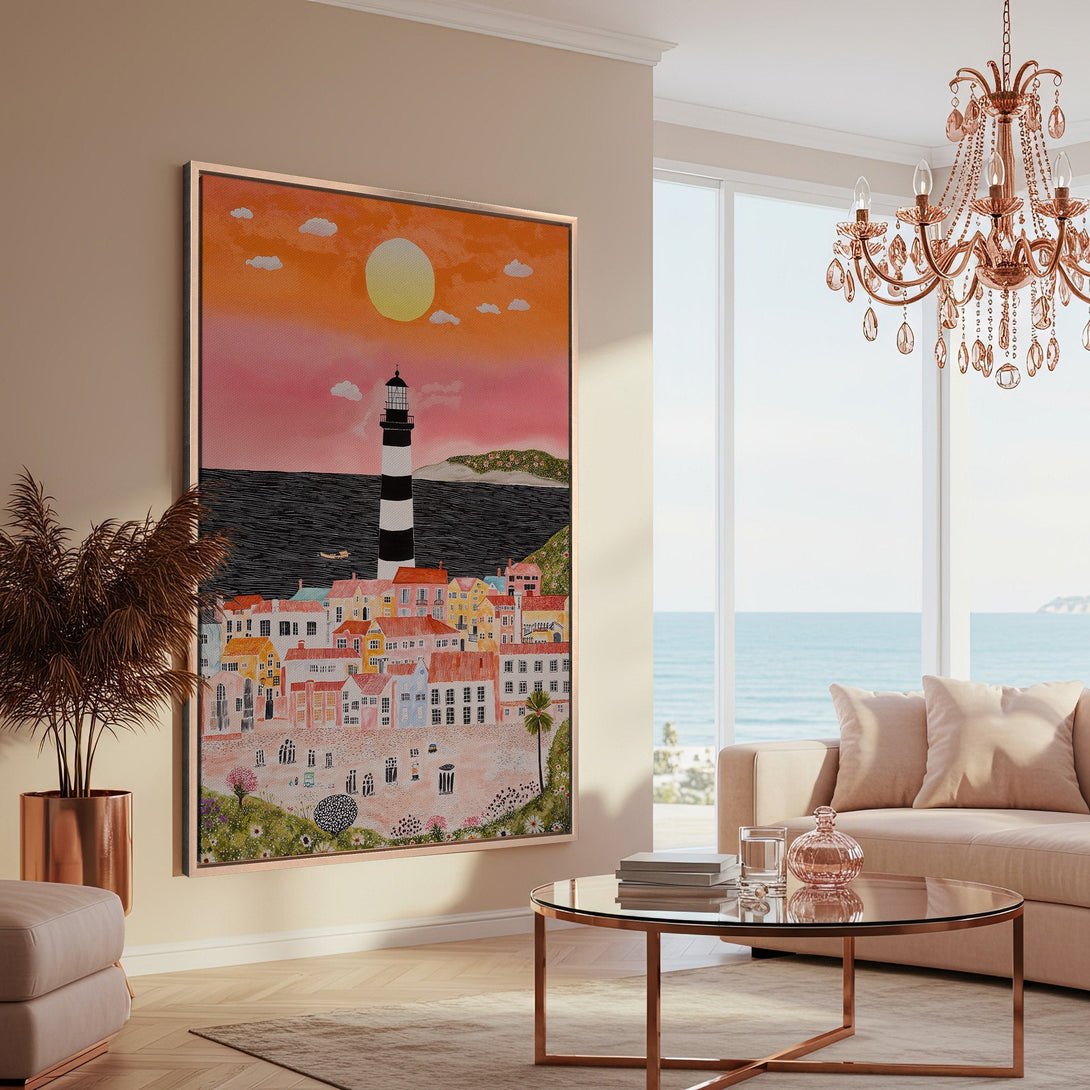 Framed Wall Art: Coastal town illustration in warm pinks & oranges. Whimsical style Canvas Print adds a touch of seaside charm to any space.