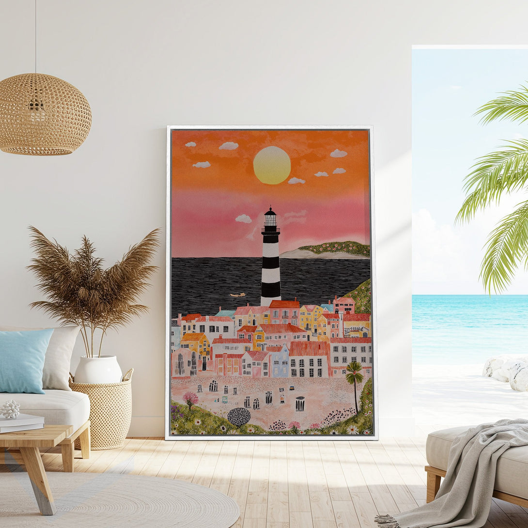 Framed Wall Art featuring a coastal town illustration with a lighthouse. Warm sunset color palette. Perfect for adding a touch of seaside charm to your home decor.