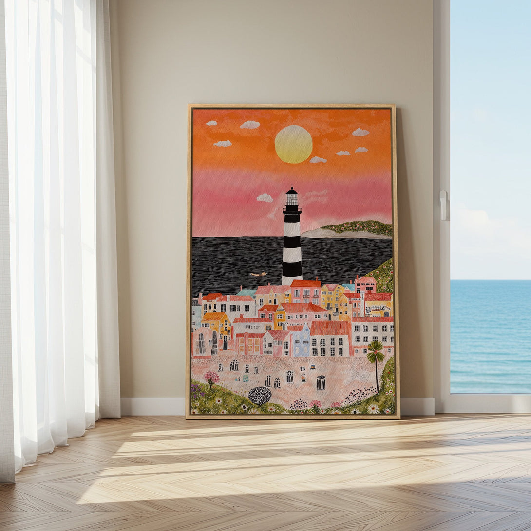 Framed Wall Art: Coastal town scene with lighthouse, colorful houses, and sunset. Warm orange, pink, and blue color palette. Perfect home decor.
