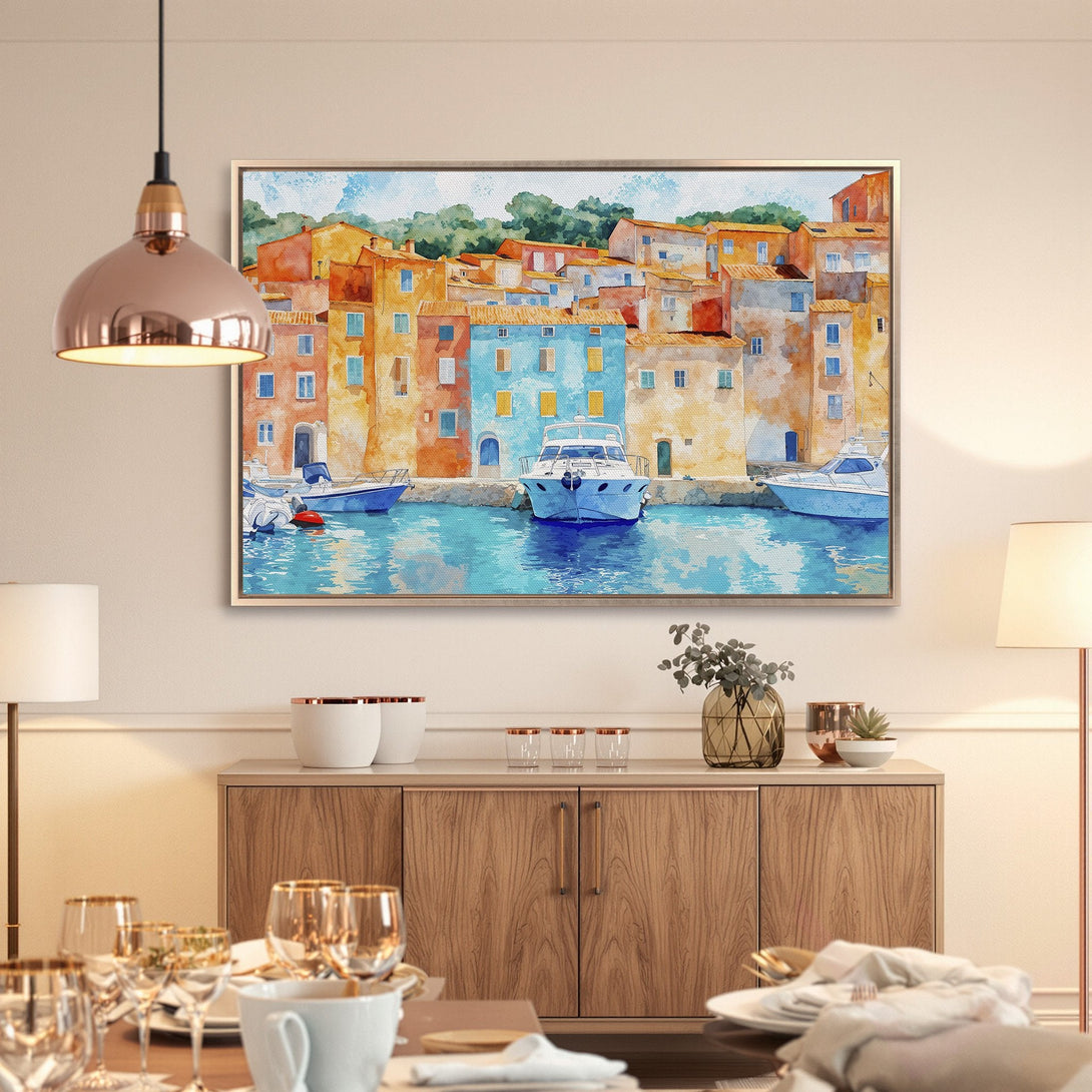 Framed Wall Art: Watercolor coastal scene in warm tones. Colorful buildings, boats, and water create a vibrant, inviting atmosphere. Perfect for home decor.