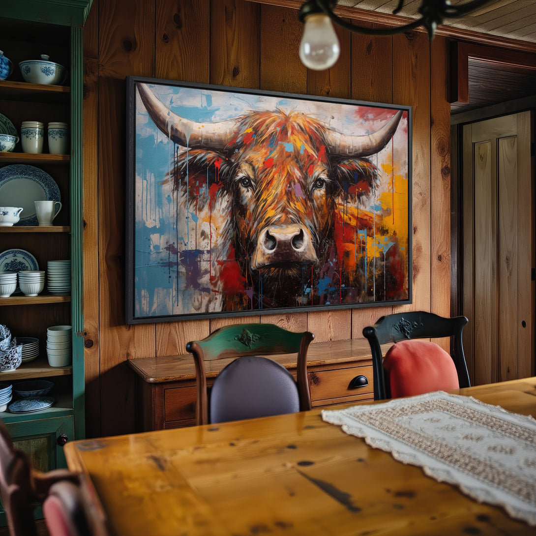 Framed Wall Art: Colorful abstract bull portrait in a rustic interior. Features vibrant reds, blues, and yellows. Perfect for farmhouse decor.