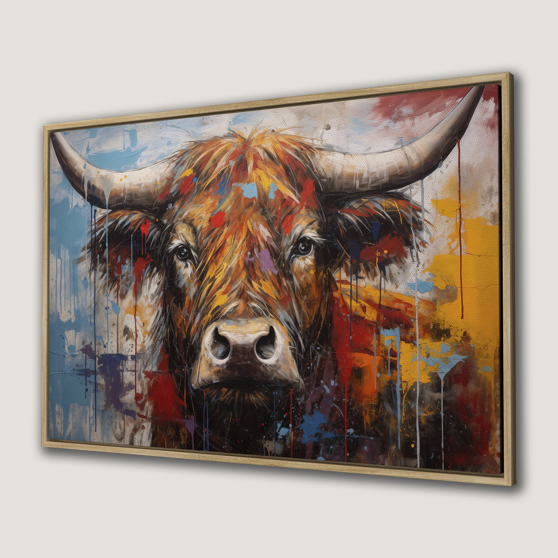 Framed Wall Art: Bold bull painting with vibrant red, orange, and blue abstract splashes. Modern canvas print perfect for rustic or contemporary decor.