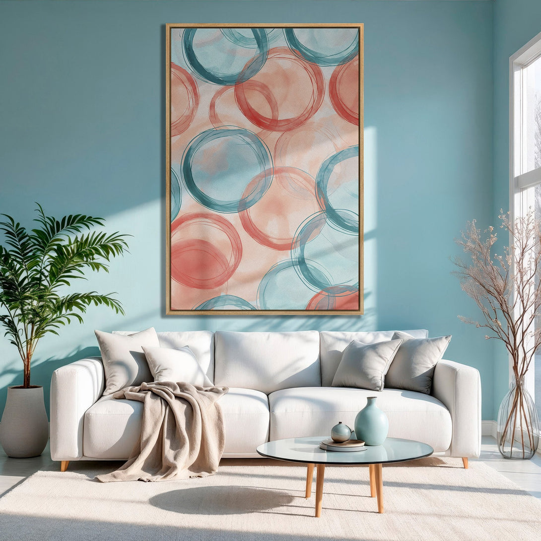 Framed Wall Art: Abstract watercolor circles in teal and coral. Modern art print adds a pop of color to a relaxing living room.