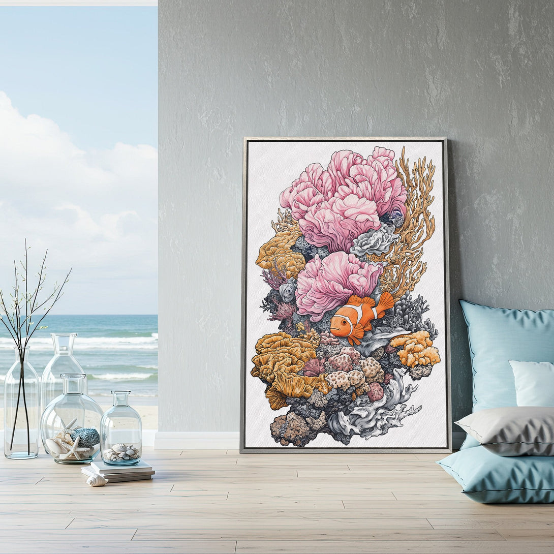 Framed Wall Art featuring a vibrant coral reef with a clownfish. Coastal style art with pink, orange, and neutral tones. Perfect for adding a pop of color to your space.