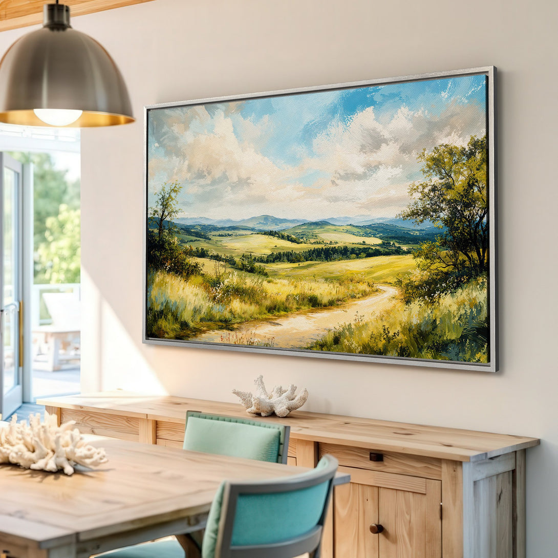 Framed Wall Art: Landscape Canvas Print with a serene countryside scene in a vibrant green, blue, and yellow palette. Perfect for adding a touch of nature to your home.