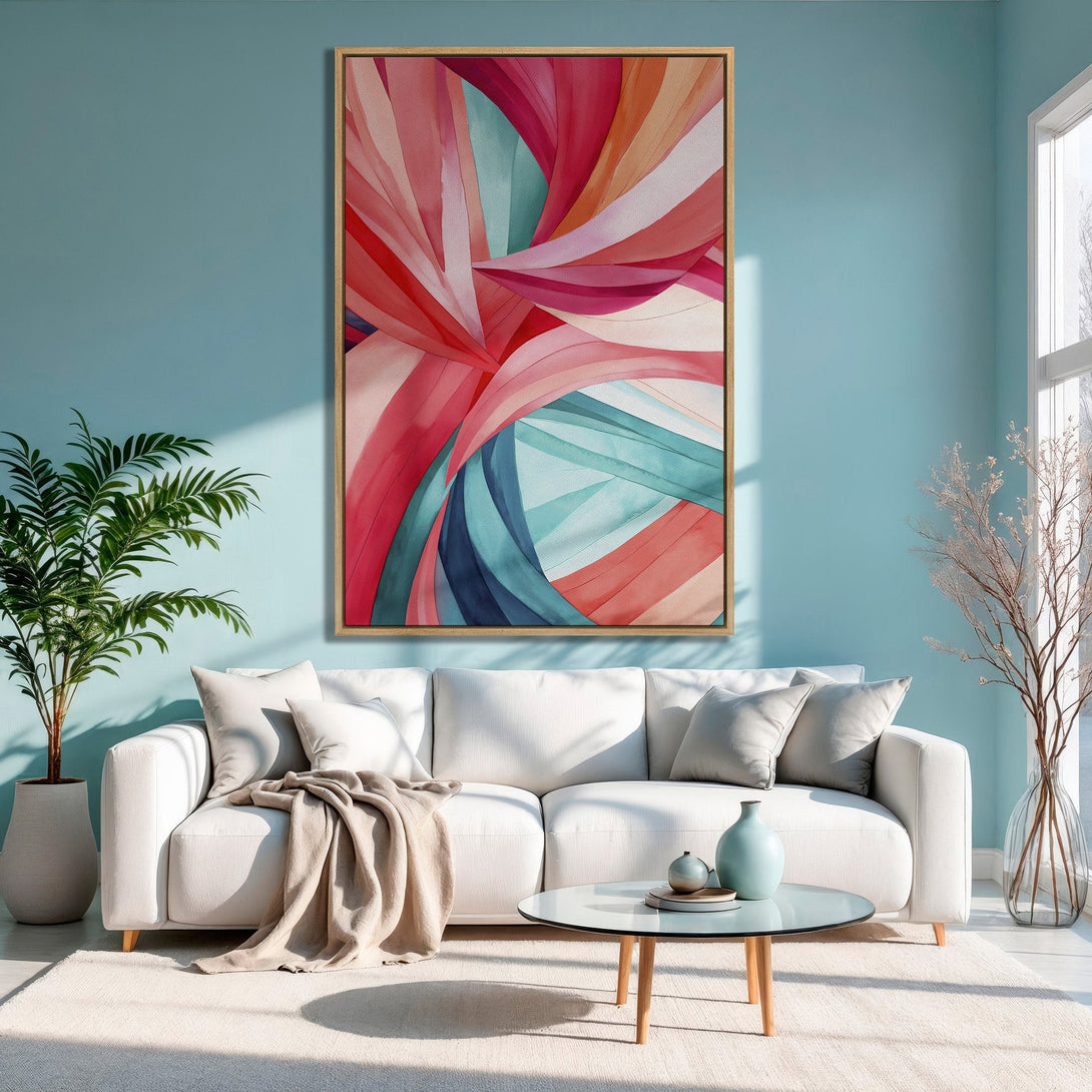 Abstract Canvas Print with vibrant red, pink, and teal hues. Modern art framed in a living room setting. Perfect for a pop of color!