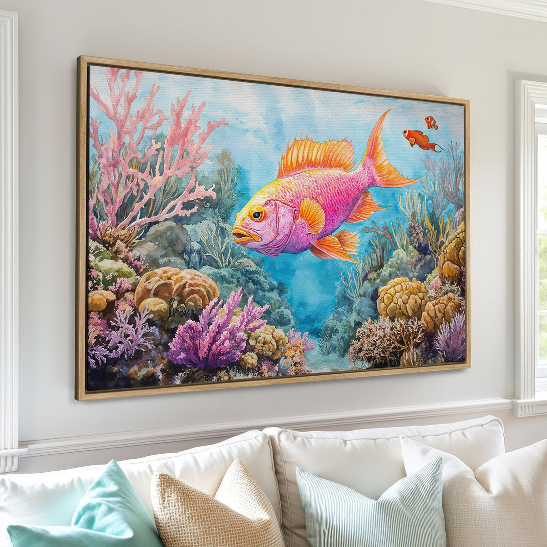 Canvas Print of a vibrant watercolor fish in an underwater scene. Featuring coral in pinks, oranges, and blues. Perfect coastal wall art!