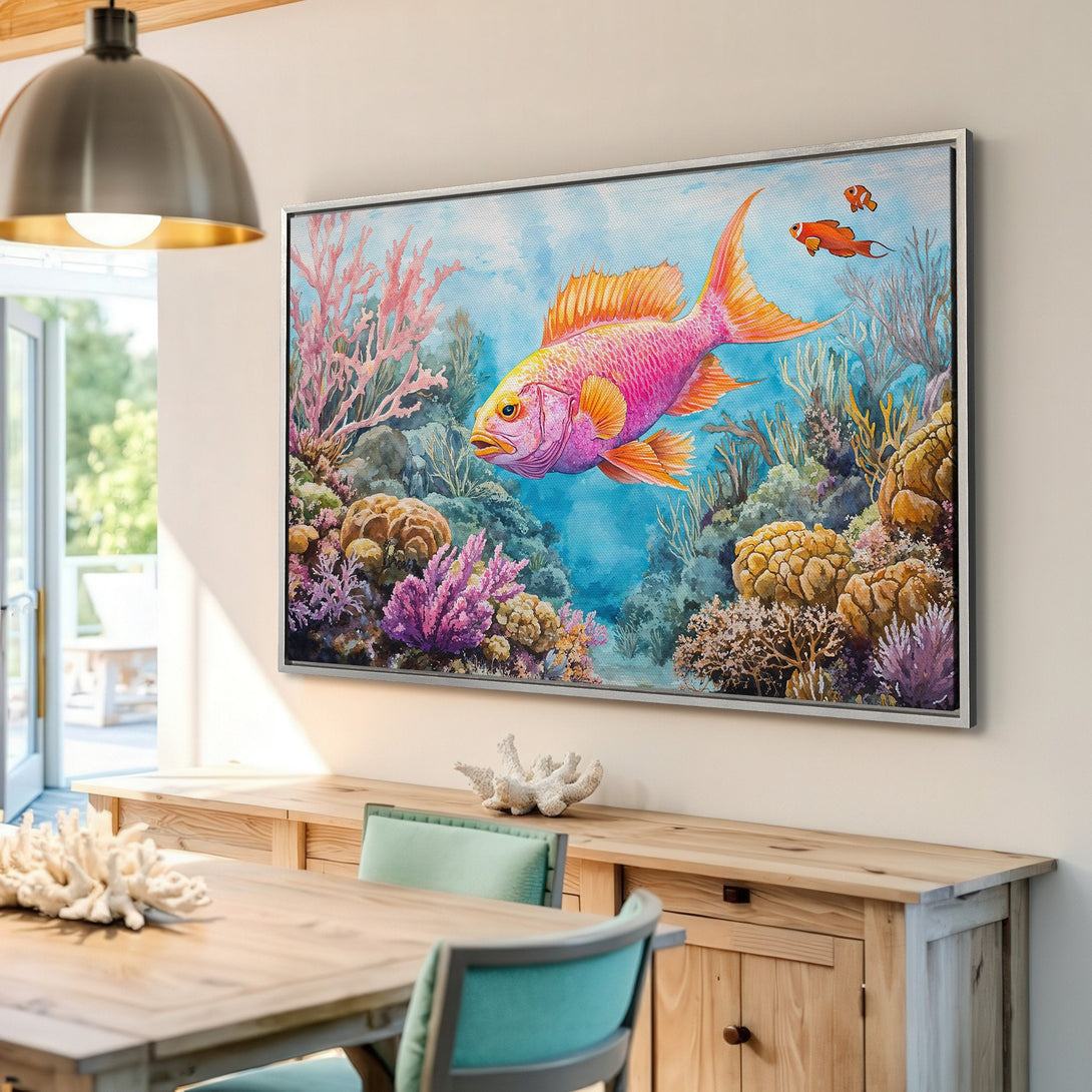 Framed Wall Art: Watercolor painting of a vibrant pink fish swimming in a coral reef. Colorful palette of pinks, oranges, blues, and greens. Perfect coastal decor!