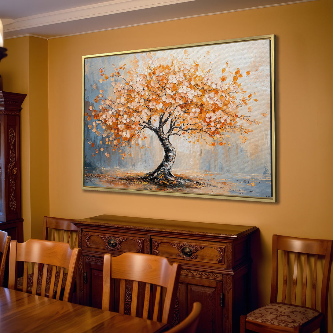 Canvas Print of an autumn tree in warm orange hues, displayed in a cozy living room. Perfect for adding a touch of nature to your home decor.