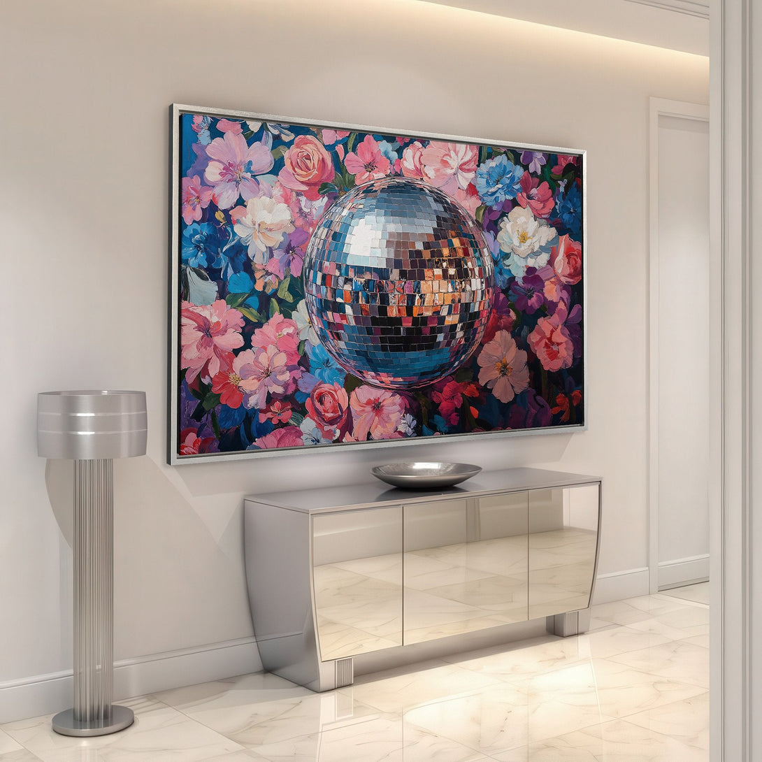 Framed Wall Art: Disco ball & floral canvas print in a modern interior. Vibrant pink, blue, and purple hues add a pop of color to any space.