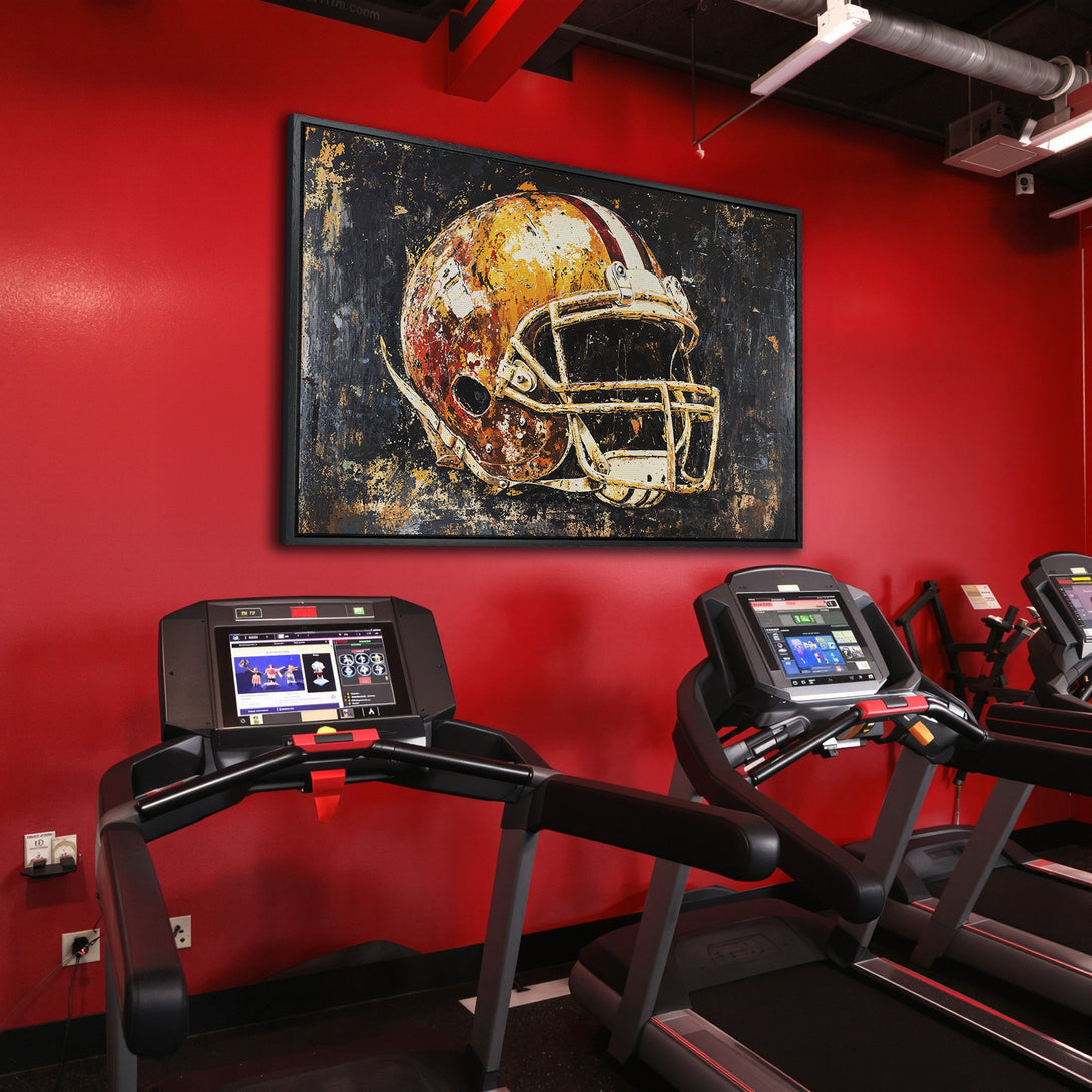 Framed Wall Art: Abstract football helmet on canvas. Bold, textured art with a warm, rusty color palette. Perfect for a gym or sports-themed space.
