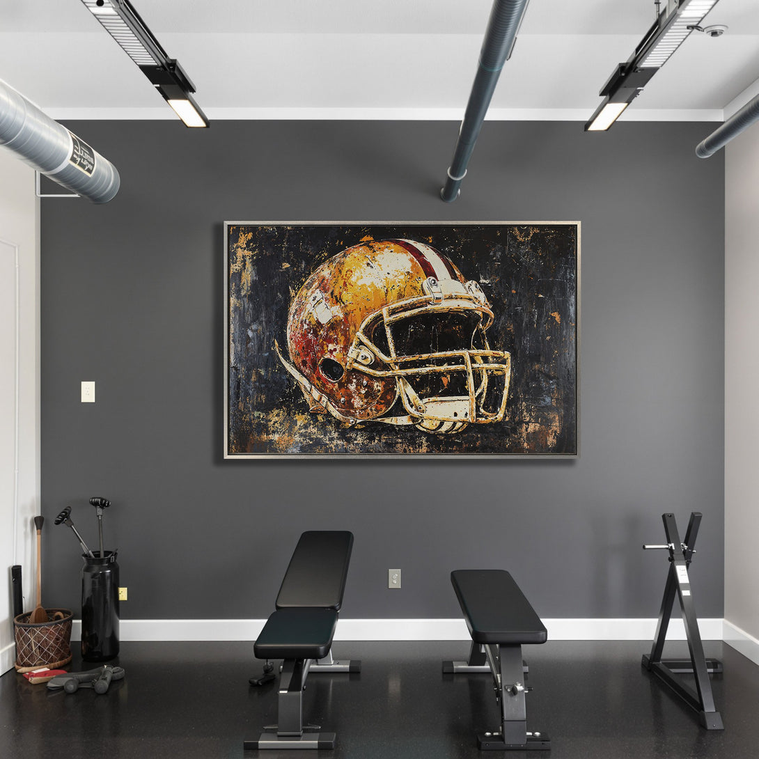 Framed Wall Art: Abstract football helmet print with a rustic, textured style. Warm gold, red, and black color palette. Perfect for sports enthusiasts!