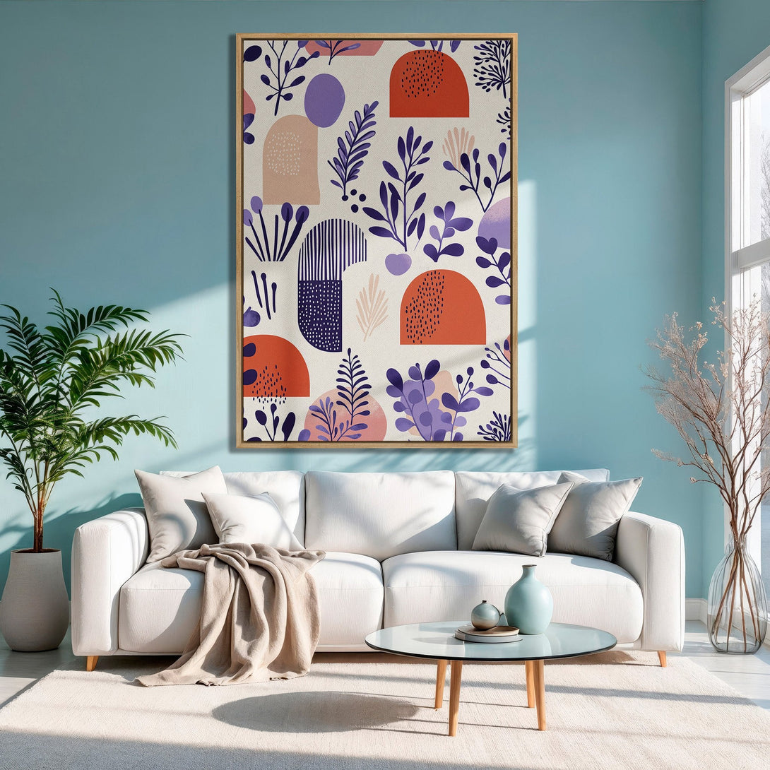 Framed Wall Art: Abstract botanical design in orange, purple, and beige. Modern canvas print adds a pop of color to a stylish living room.