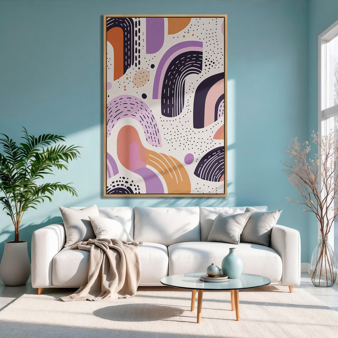 Framed Wall Art: Abstract art Canvas Print with a modern style, featuring a colorful palette of orange, purple, and pink tones, displayed in a living room.
