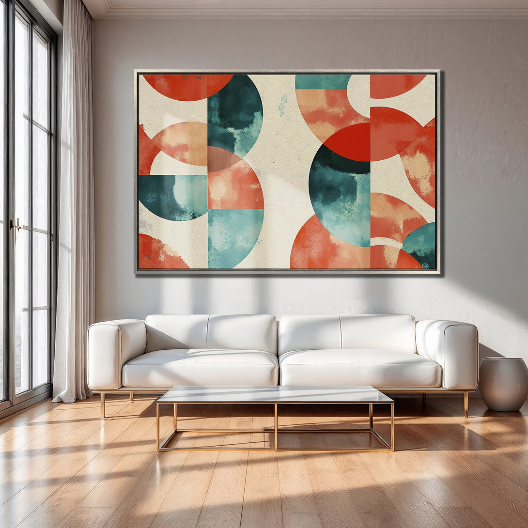 Framed Wall Art: Abstract geometric art in red, teal, and beige. Modern canvas print adds a pop of color to a stylish living room.