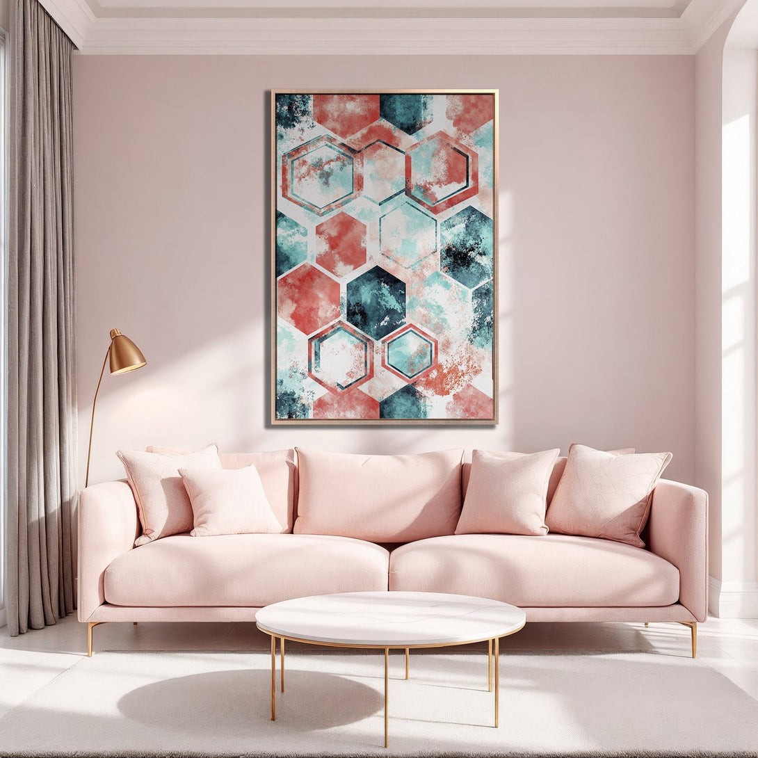 Framed Wall Art featuring abstract watercolor hexagons in teal, coral, and black. Modern art adds a pop of color to a stylish living room.