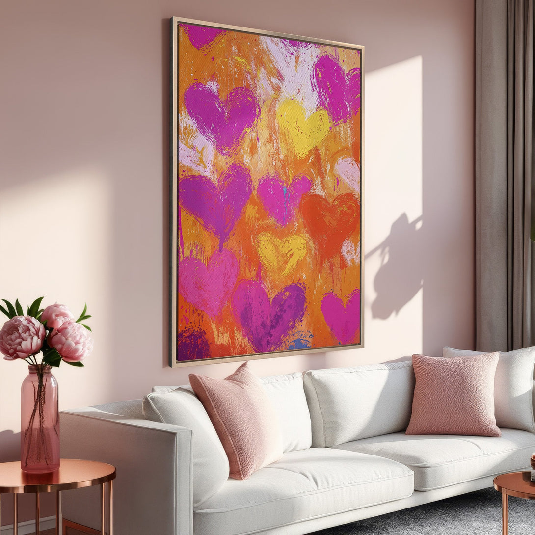 Framed Wall Art featuring a vibrant abstract heart design in a warm, colorful palette of pink, orange, and yellow. Perfect for adding a pop of art to your home!