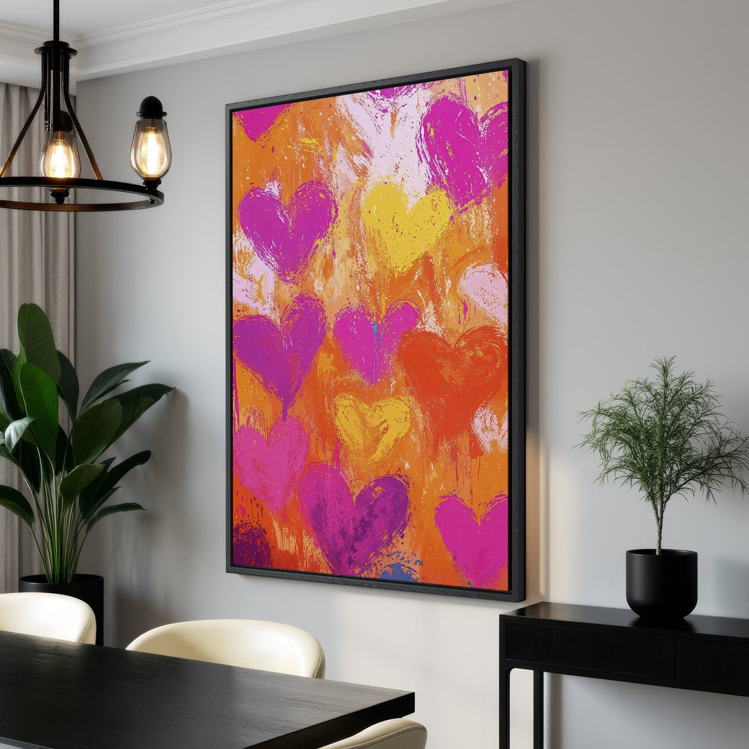 Framed Wall Art featuring abstract hearts in vibrant pink, orange, and yellow. Modern art canvas print adds a pop of color to any interior space.