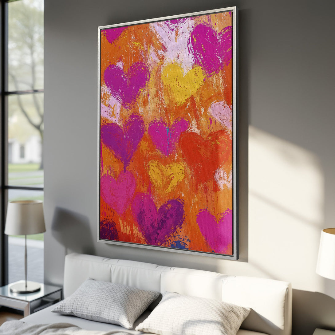 Framed Wall Art featuring a vibrant abstract heart design in pinks, oranges, and yellows. Perfect for adding a pop of color to your bedroom decor.