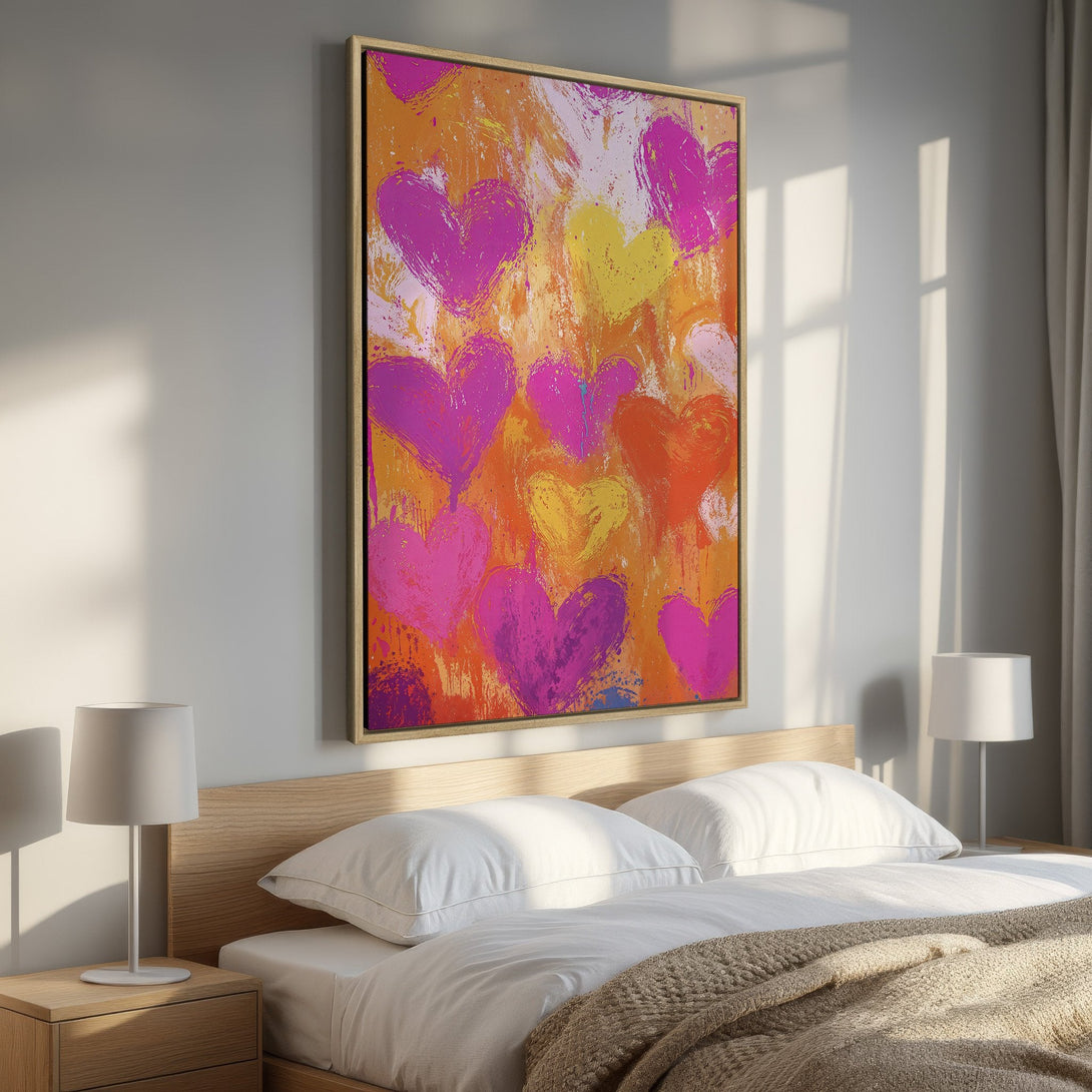 Framed Wall Art featuring abstract hearts in vibrant pink, orange, and yellow hues. Modern art canvas print perfect for bedroom decor.