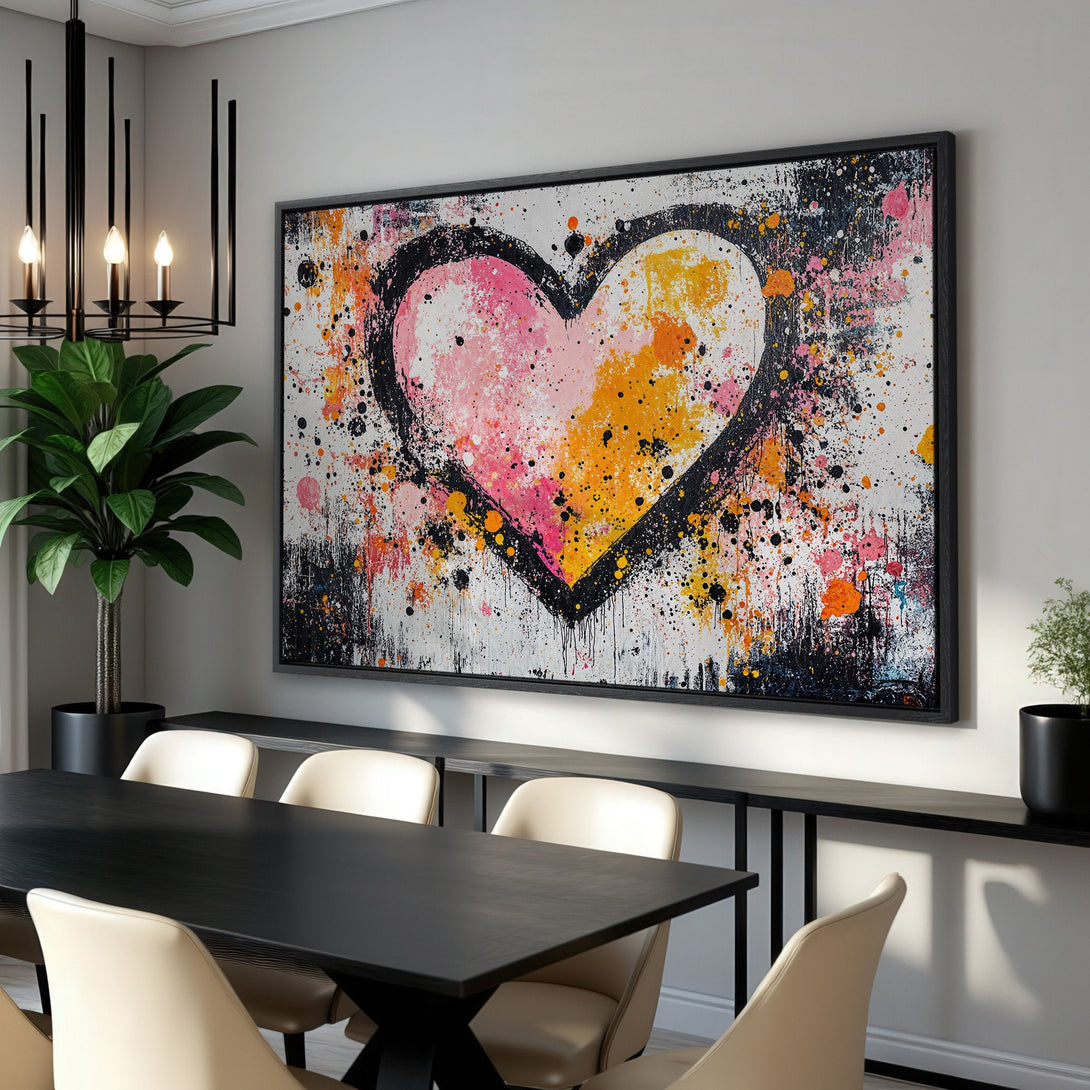 Framed Wall Art featuring an abstract heart in pink, orange, and black. Modern, expressive style, perfect for adding a pop of color to any room.