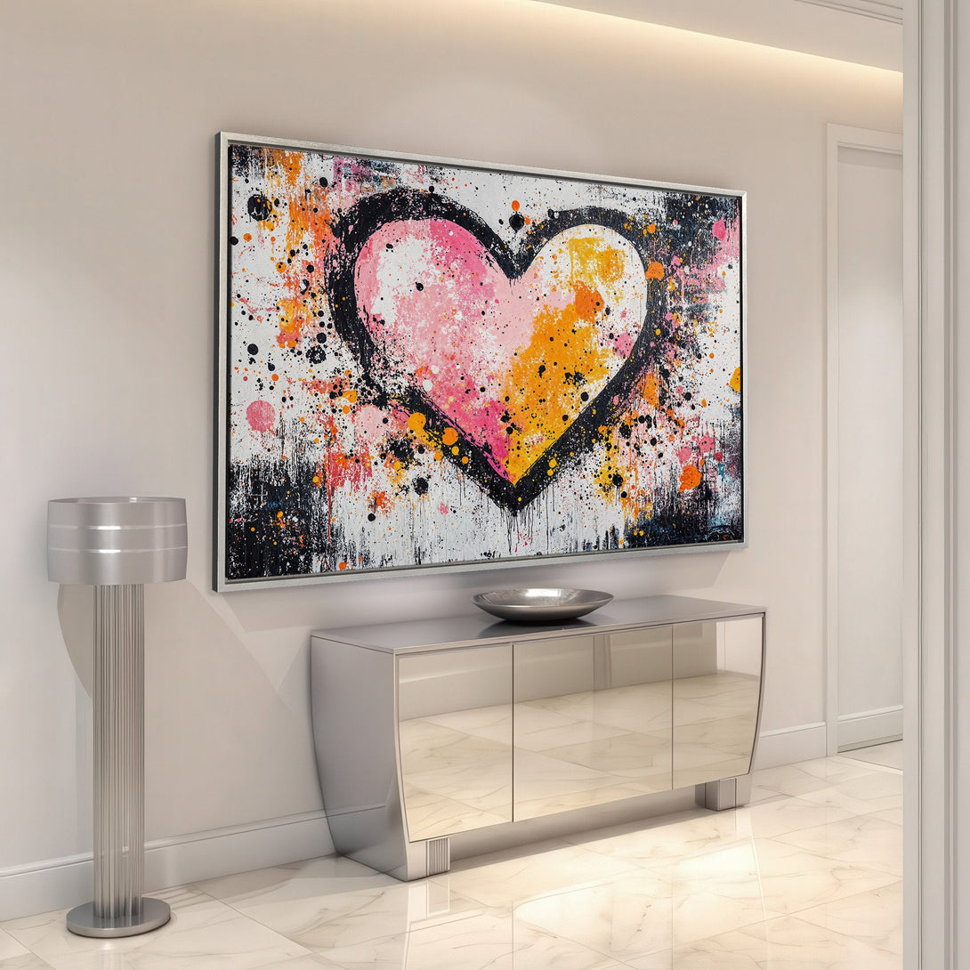 Framed Wall Art: Abstract heart painting with vibrant pink, orange, and black splatter art. Modern decor for a stylish interior.