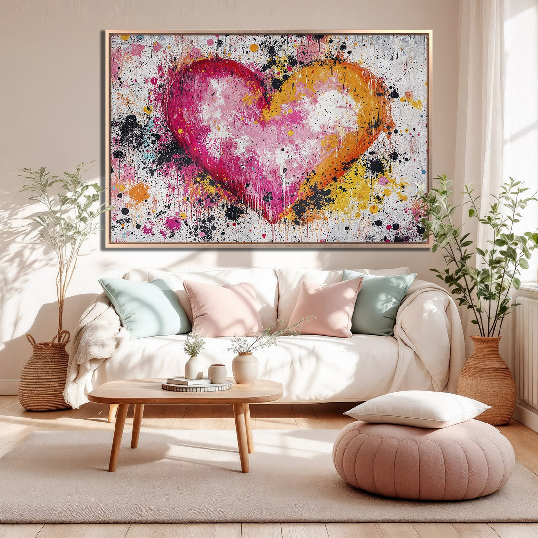 Framed Wall Art: Abstract heart canvas print in vibrant pink, orange, and yellow, perfect for modern home decor. Adds a pop of color to any living space.