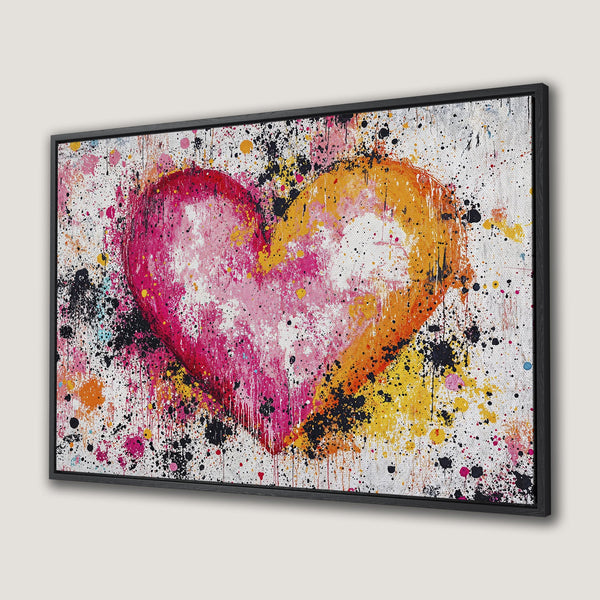 Framed Wall Art: Abstract heart painting in vibrant pink, orange, and yellow hues. Modern, expressive style perfect for adding color to any space.
