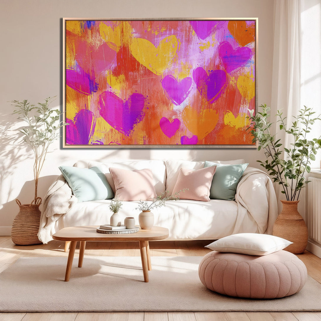Framed Wall Art: Abstract heart painting in vibrant pink, orange, and yellow hues. Modern art canvas print perfect for living room decor.
