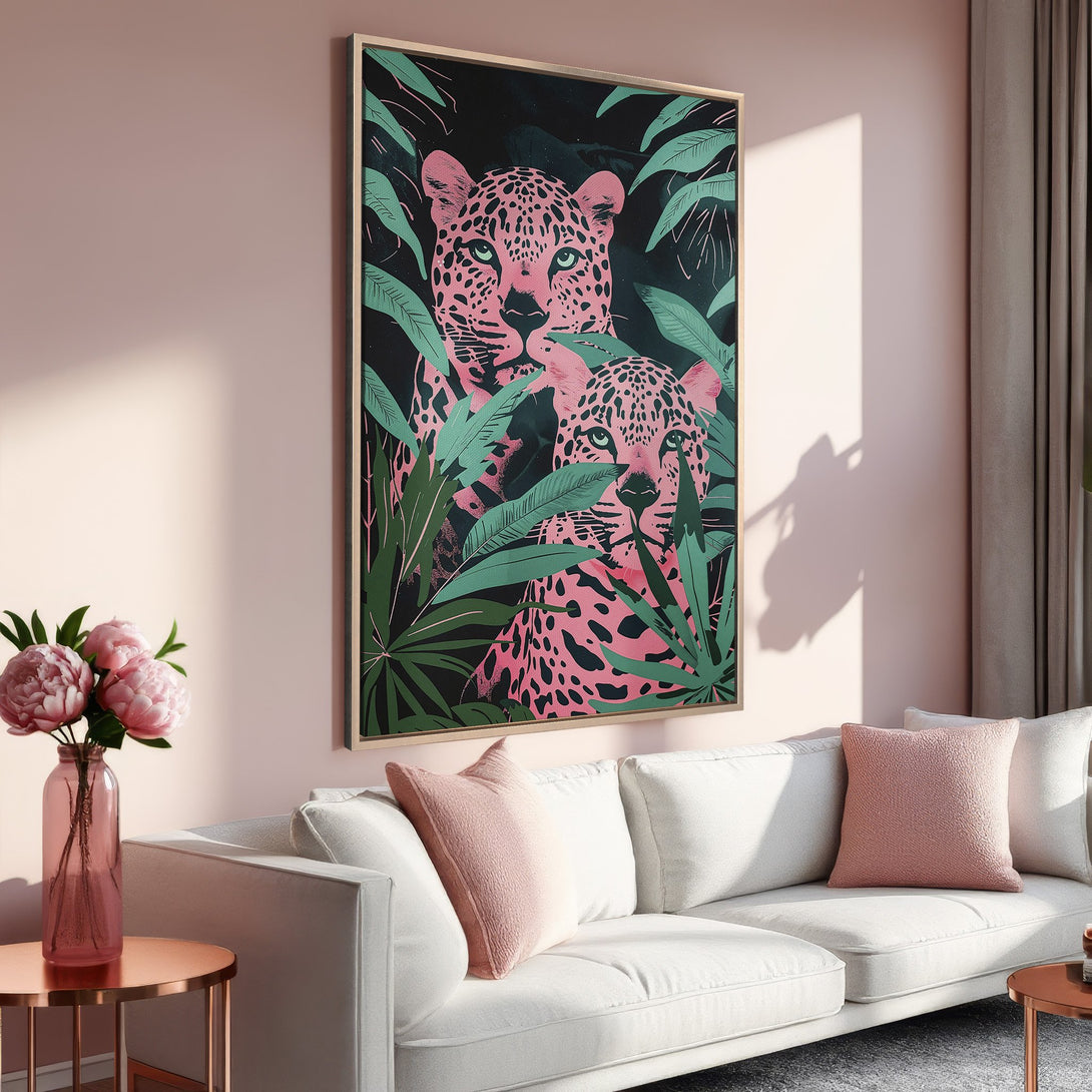 Framed Wall Art: Pink leopard print canvas in a modern interior. Features a jungle scene with a pink and green color palette. Perfect for adding a pop of color!