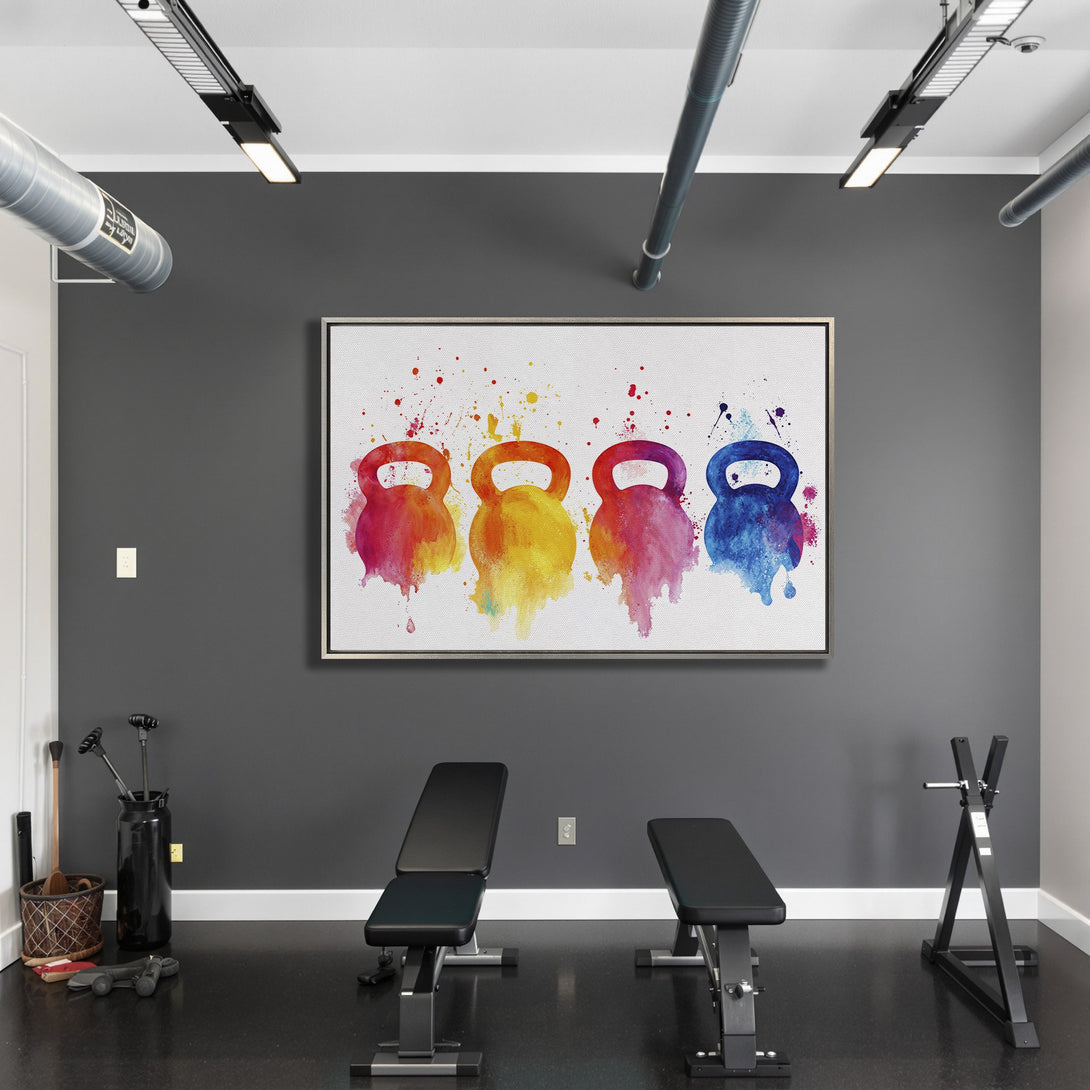 Framed Wall Art: Colorful watercolor kettlebell print in a gym. Vibrant reds, yellows, blues, and purples pop against a neutral gray wall. Elevate your space!