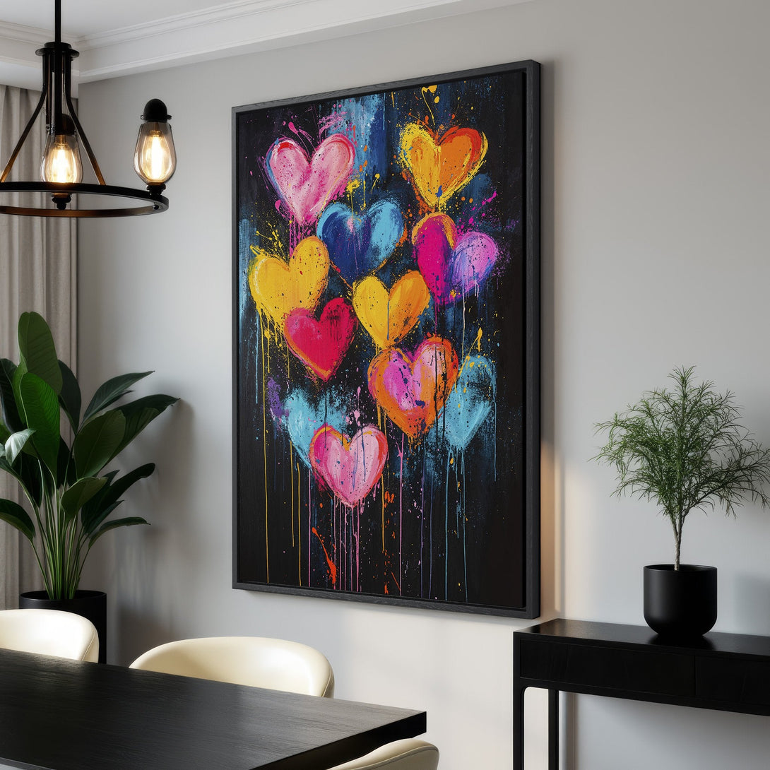 Framed Wall Art featuring colorful, abstract hearts on a black background. Modern art with a vibrant, eye-catching palette. Perfect for adding love and style.