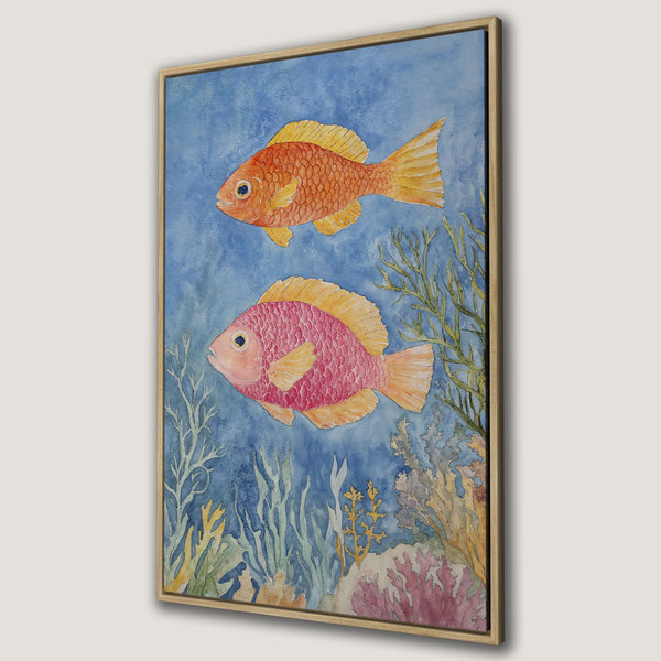 Framed Wall Art featuring watercolor fish in vibrant orange and pink hues against a blue background. Perfect for adding a touch of coastal charm!