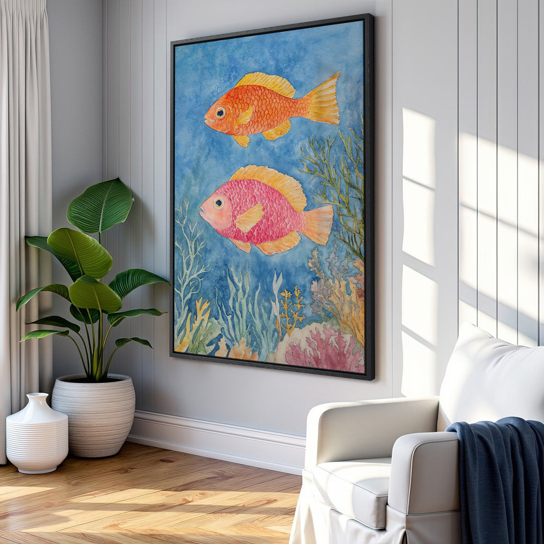 Framed Wall Art featuring watercolor fish in a blue, orange, and pink palette. Perfect coastal decor for your living room or bedroom.