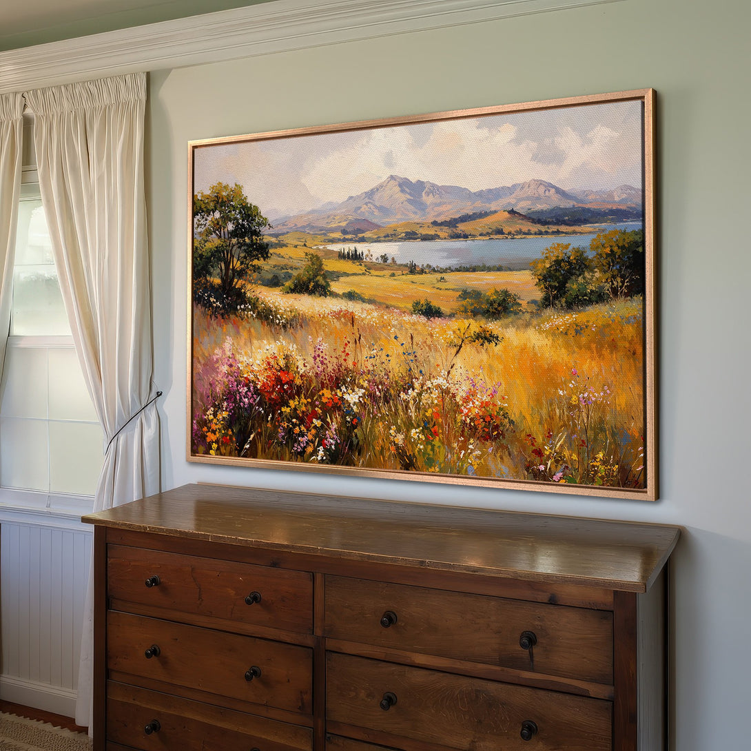 Framed Wall Art: Landscape Canvas Print with a warm, golden color palette. Features a vibrant meadow scene with mountains and lake in the background.
