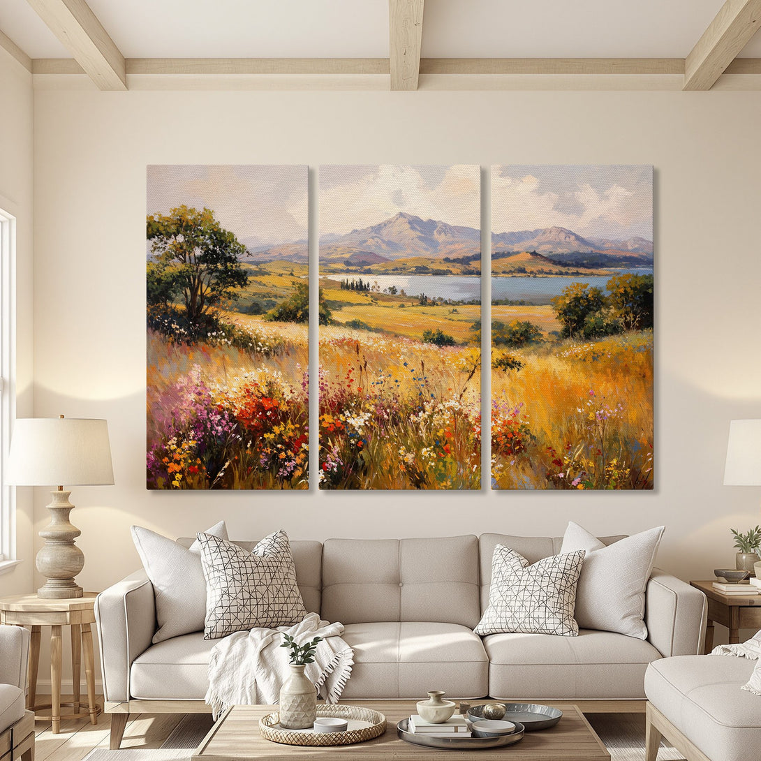 Canvas Print of a serene landscape painting with a warm color palette of yellows, greens, and purples, displayed in a cozy living room setting.