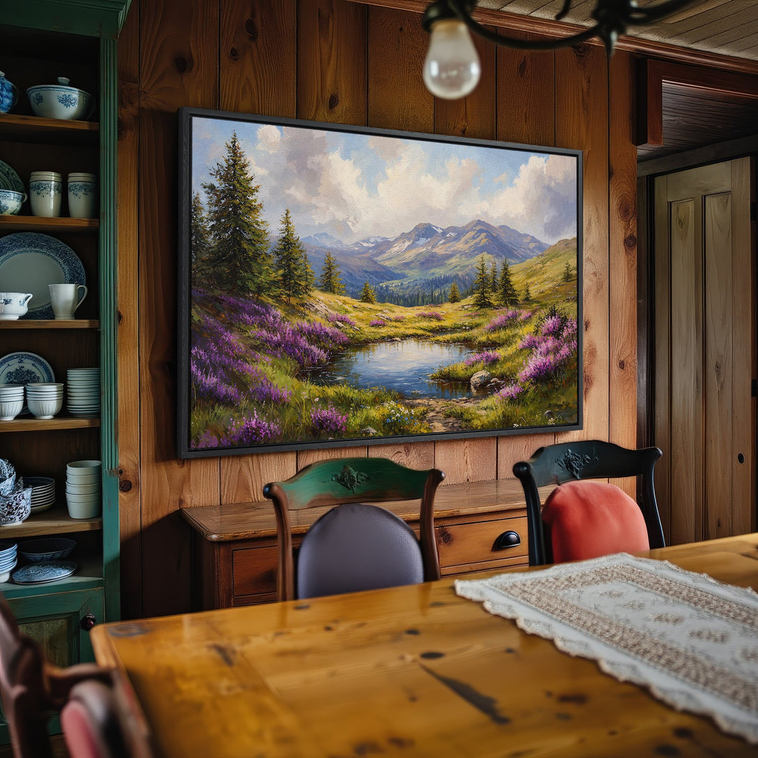 Framed Wall Art: Landscape Canvas Print with mountain scene, featuring a serene lake and purple flowers. Earthy tones create a cozy, inviting atmosphere.