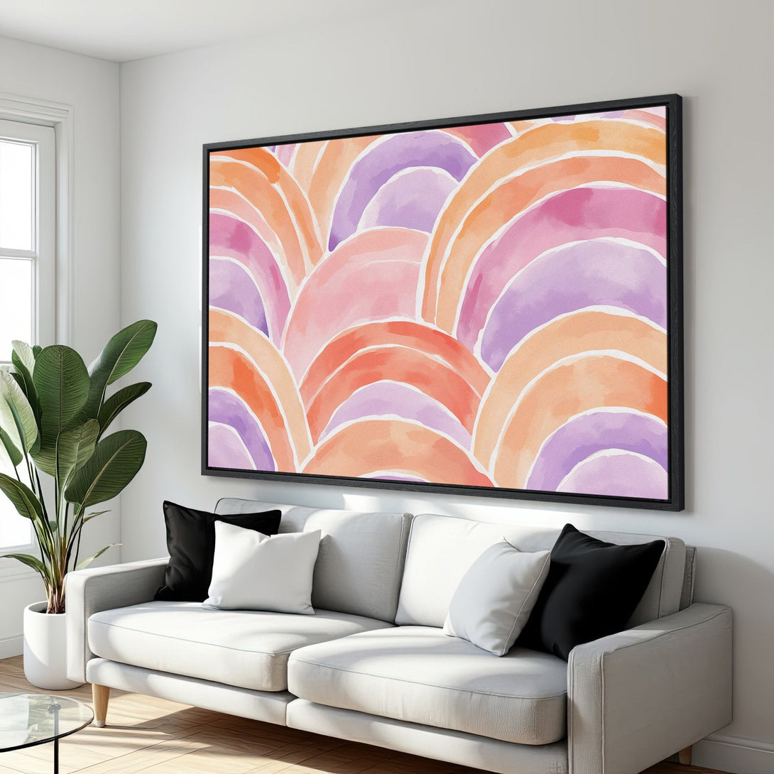 Framed Wall Art featuring a watercolor abstract design in warm pinks, oranges, and purples. Modern art for your living room.