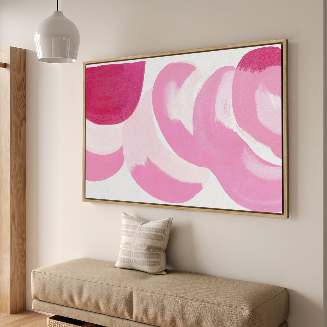 Framed Wall Art: Abstract pink brushstroke painting in a modern interior. Adds a pop of color with a vibrant pink palette to any space.