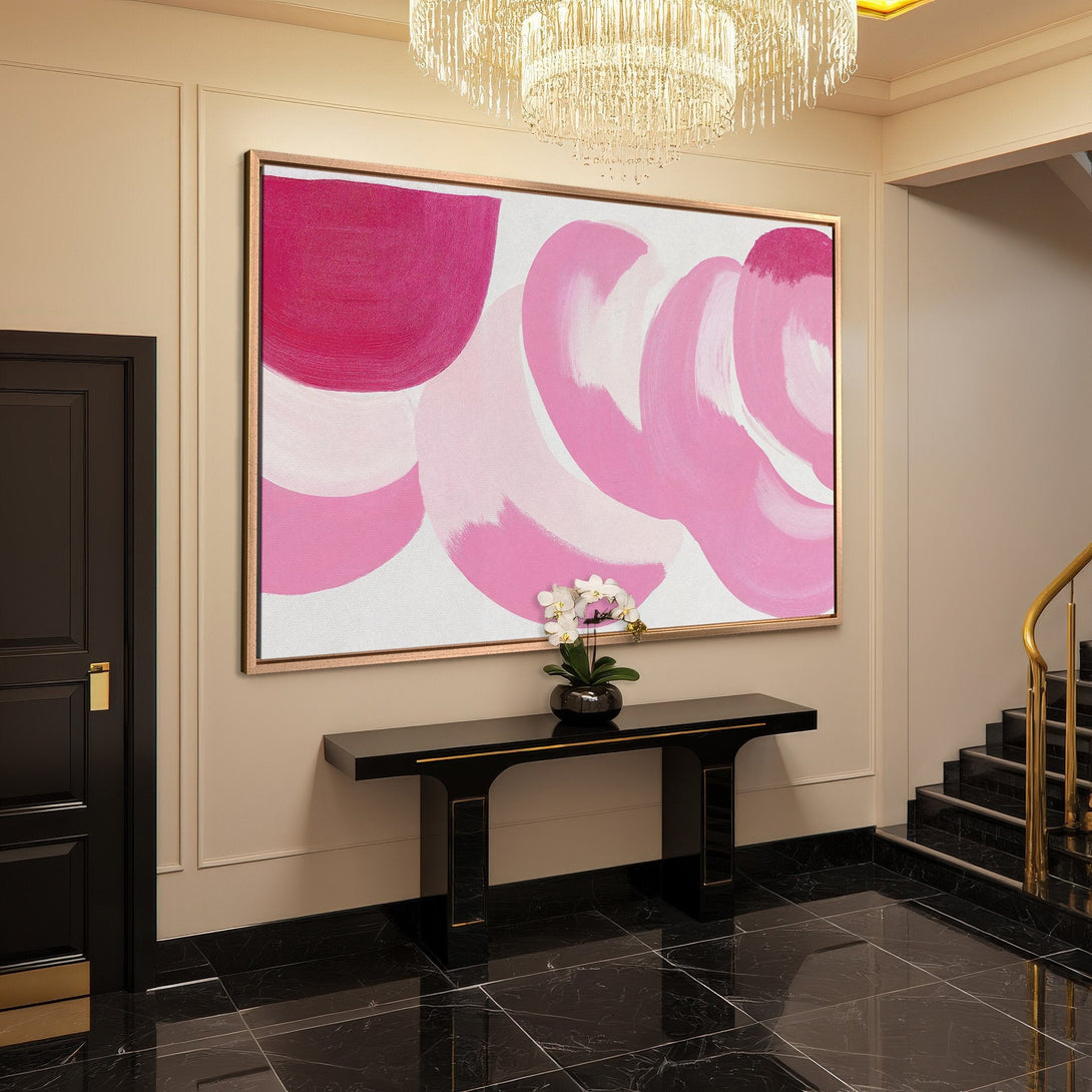 Framed Wall Art featuring abstract pink brushstrokes. Modern art canvas print adds a pop of color to any interior. Perfect for living rooms and hallways.